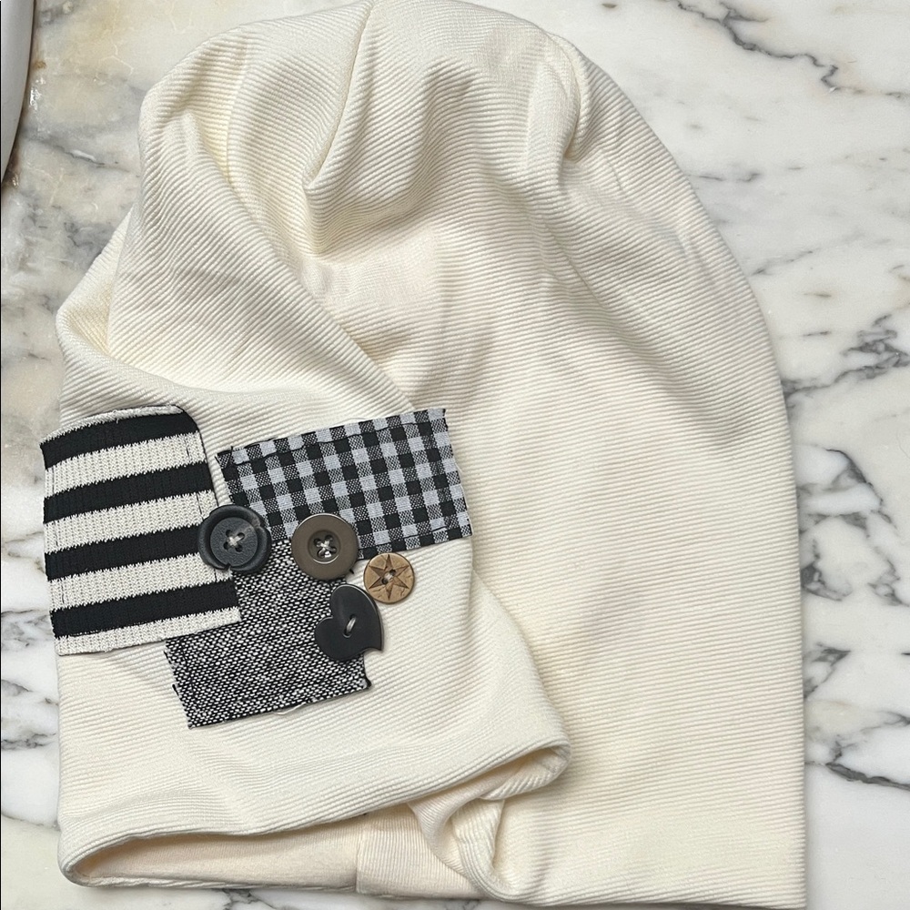 NWOT Cream Beanie with Patchwork Design